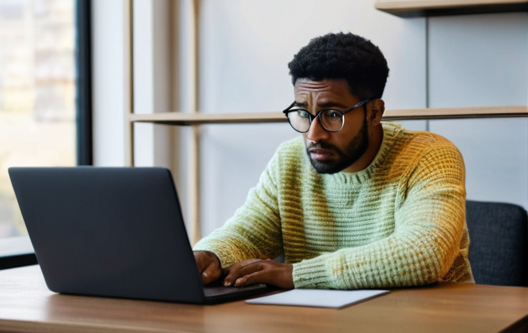 다크패턴의 사회적 논란 - **Prompt:** A person, appearing frustrated and slightly stressed, sits in front of a laptop at a nea...